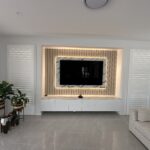 Customised wood panel entertainment unit with storage cabinets under the TV – Hills Wide Kitchens
