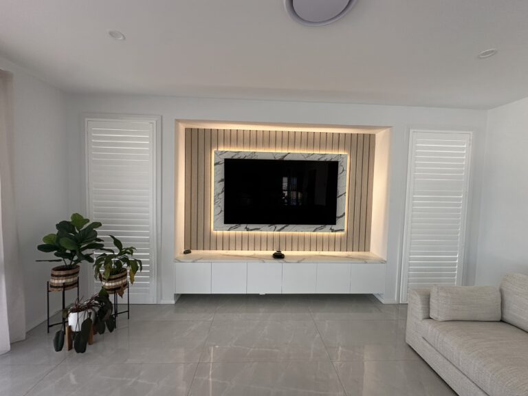Customised wood panel entertainment unit with storage cabinets under the TV – Hills Wide Kitchens
