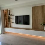 Hills Wide Kitchens - Modern wood panel entertainment unit with shelves