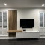 Hills Wide Kitchens - Simple floating Wood Panel TV Unit